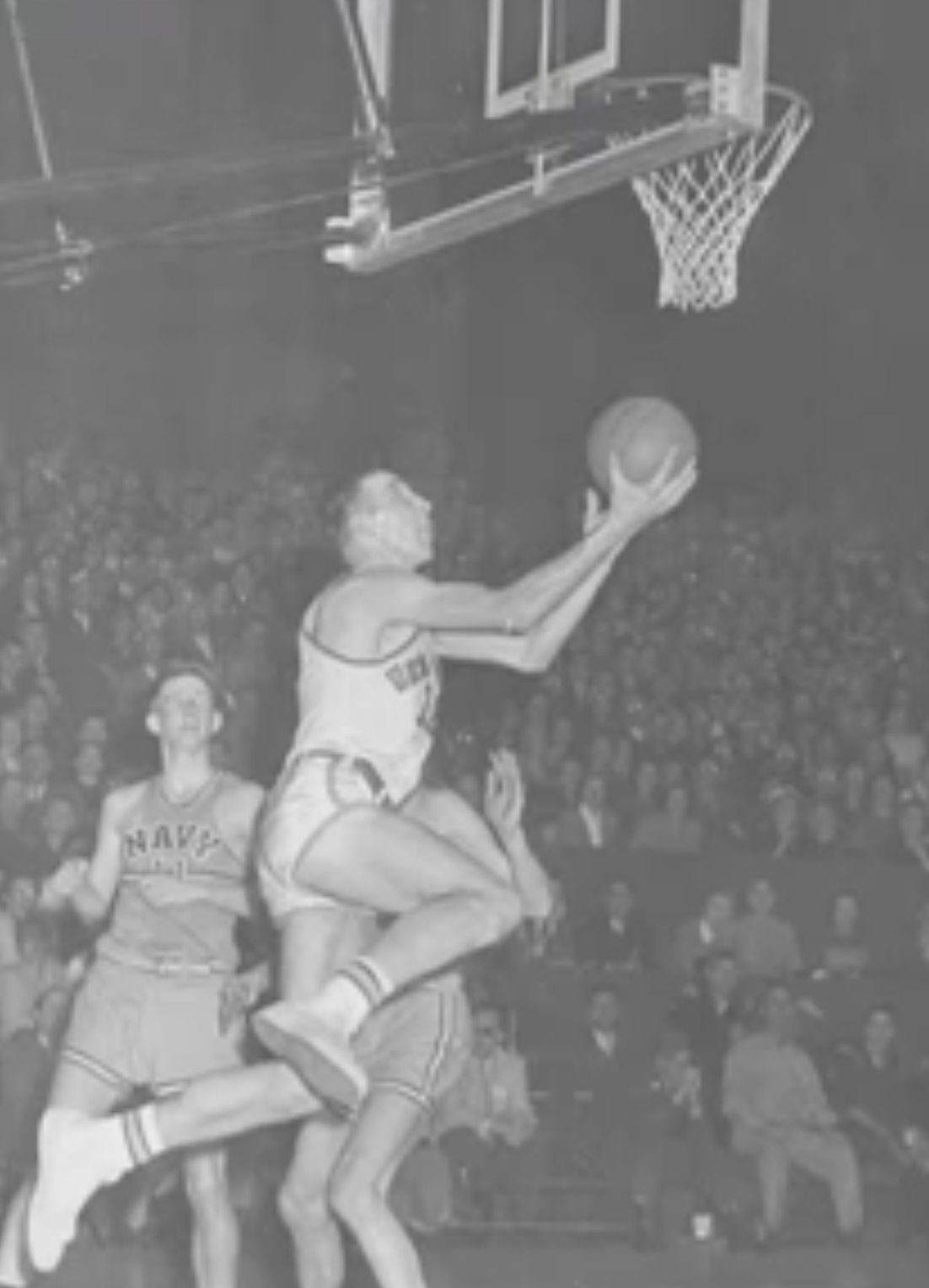 Hannon driving for a layup against Navy